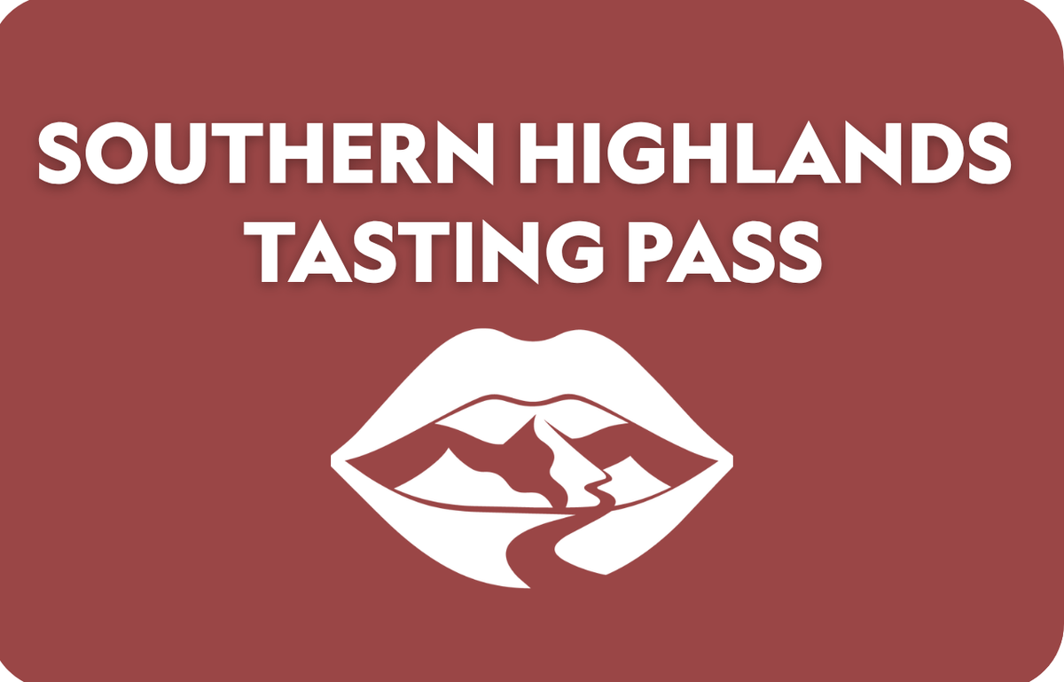 A rectangular card or sign with rounded corners, featuring the text 'SOUTHERN HIGHLANDS TASTING PASS' in white on a muted reddish-brown background, with a white stylized lips-and-mountains icon below.